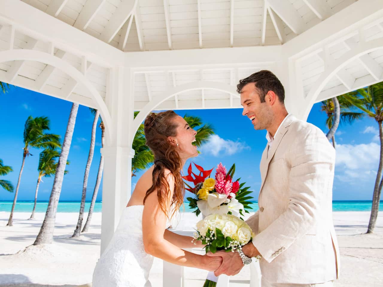 Wedding ceremony setup on resort beachfront