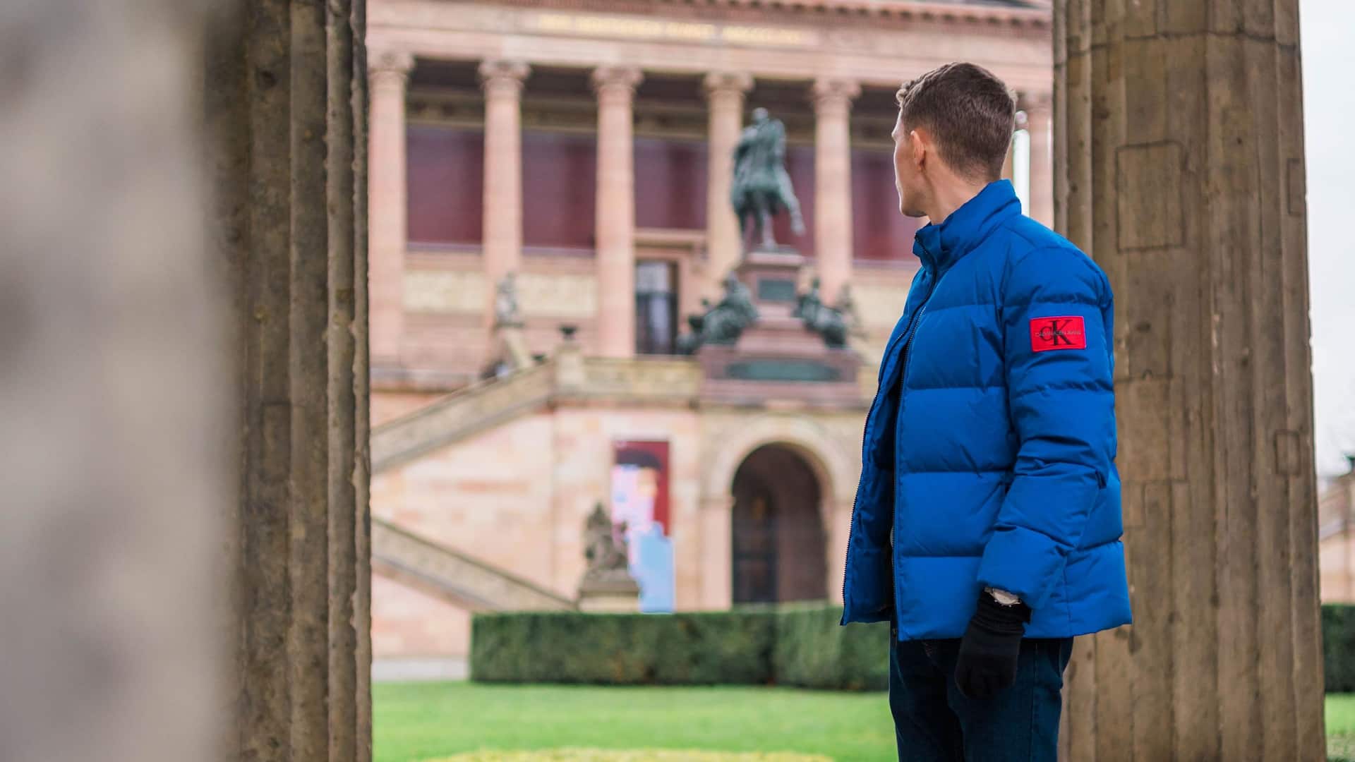Man in blue winter jacket looks at Neues Museum near Grand Hyatt Berlin