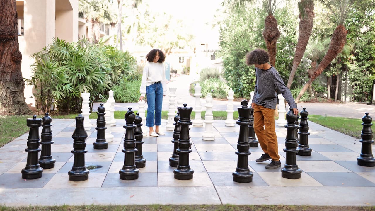 Children playing giant chess