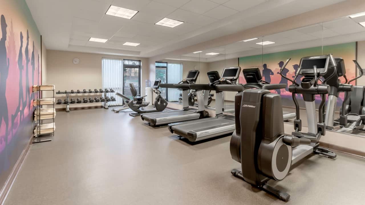 Hotel 24/7 fitness canter with free weights, treadmills, and elliptical machines at Hyatt Place Richmond / Arboretum