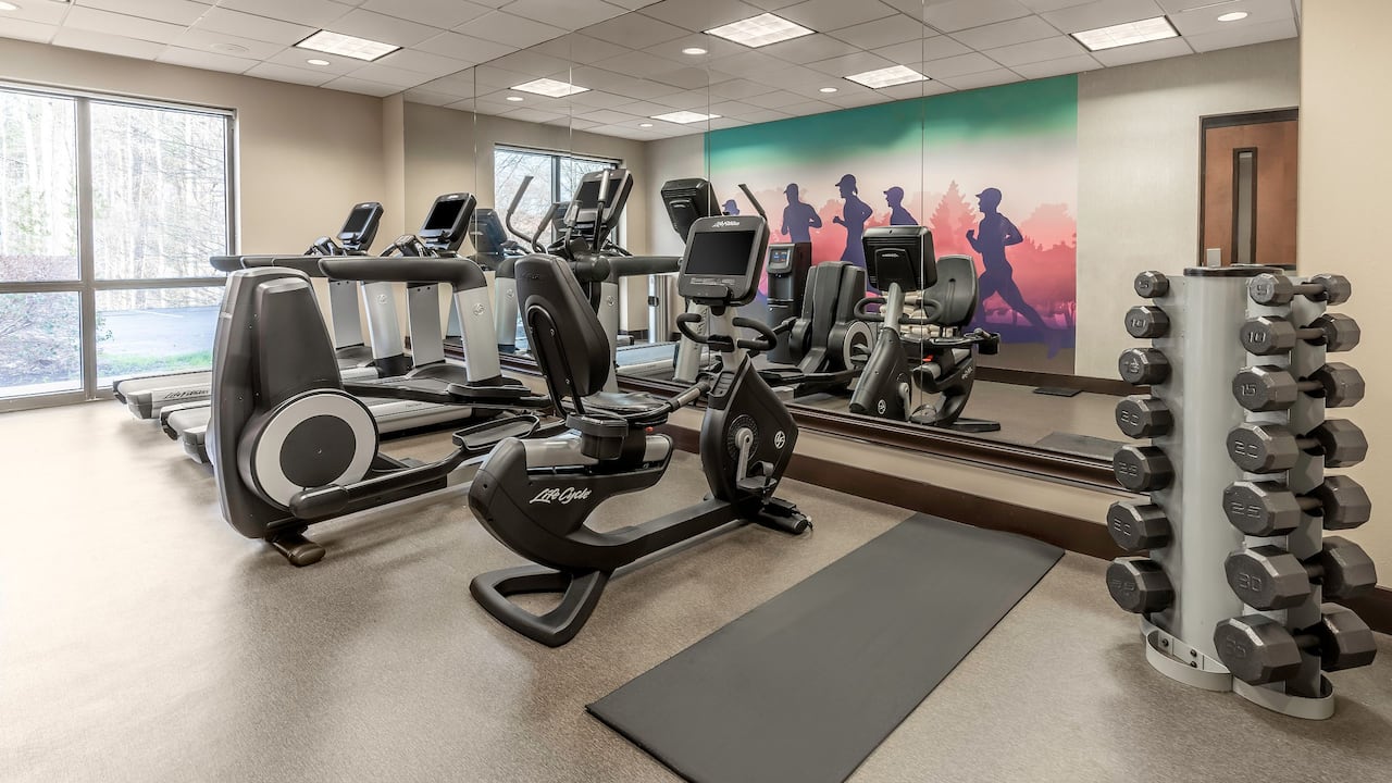 Fitness Center with treadmills and elliptical machines.