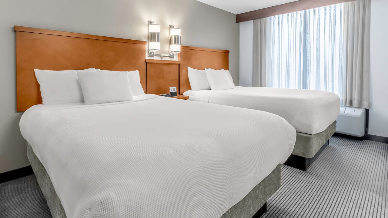 Double queen-sized beds in guestroom at Hyatt hotel in Charlotte.