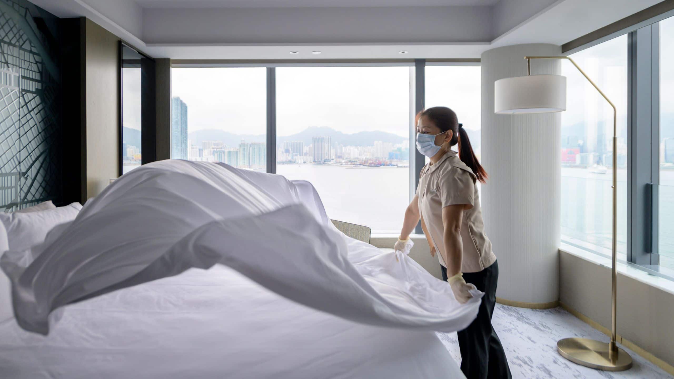Global Housekeeping Staff Wears Mask and Gloves