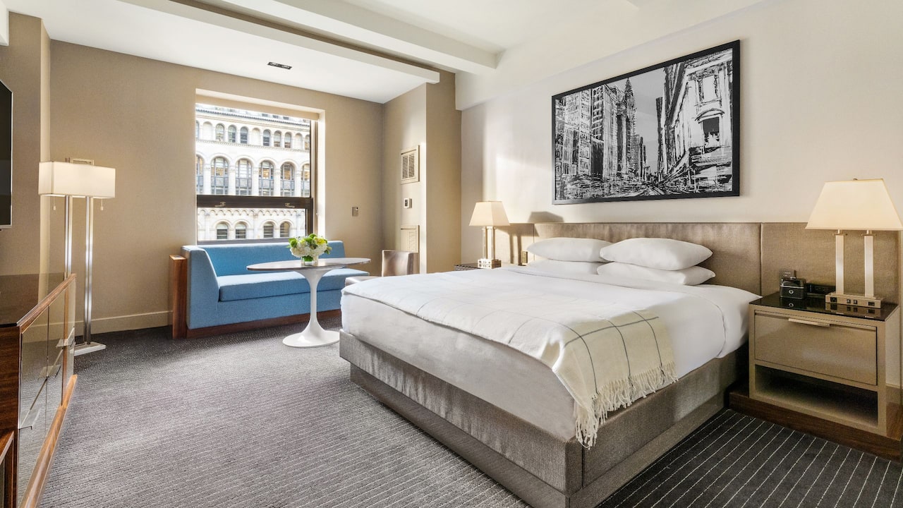 One King Bed Deluxe guestroom with window chaise and city views at Hyatt Grand Central New York
