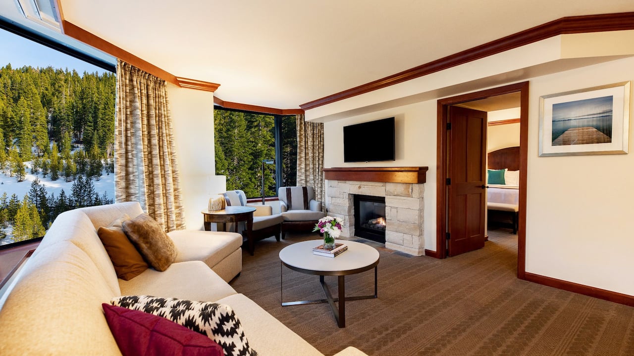 Deluxe Fireplace Suite Forest View Living Area and Bedroom