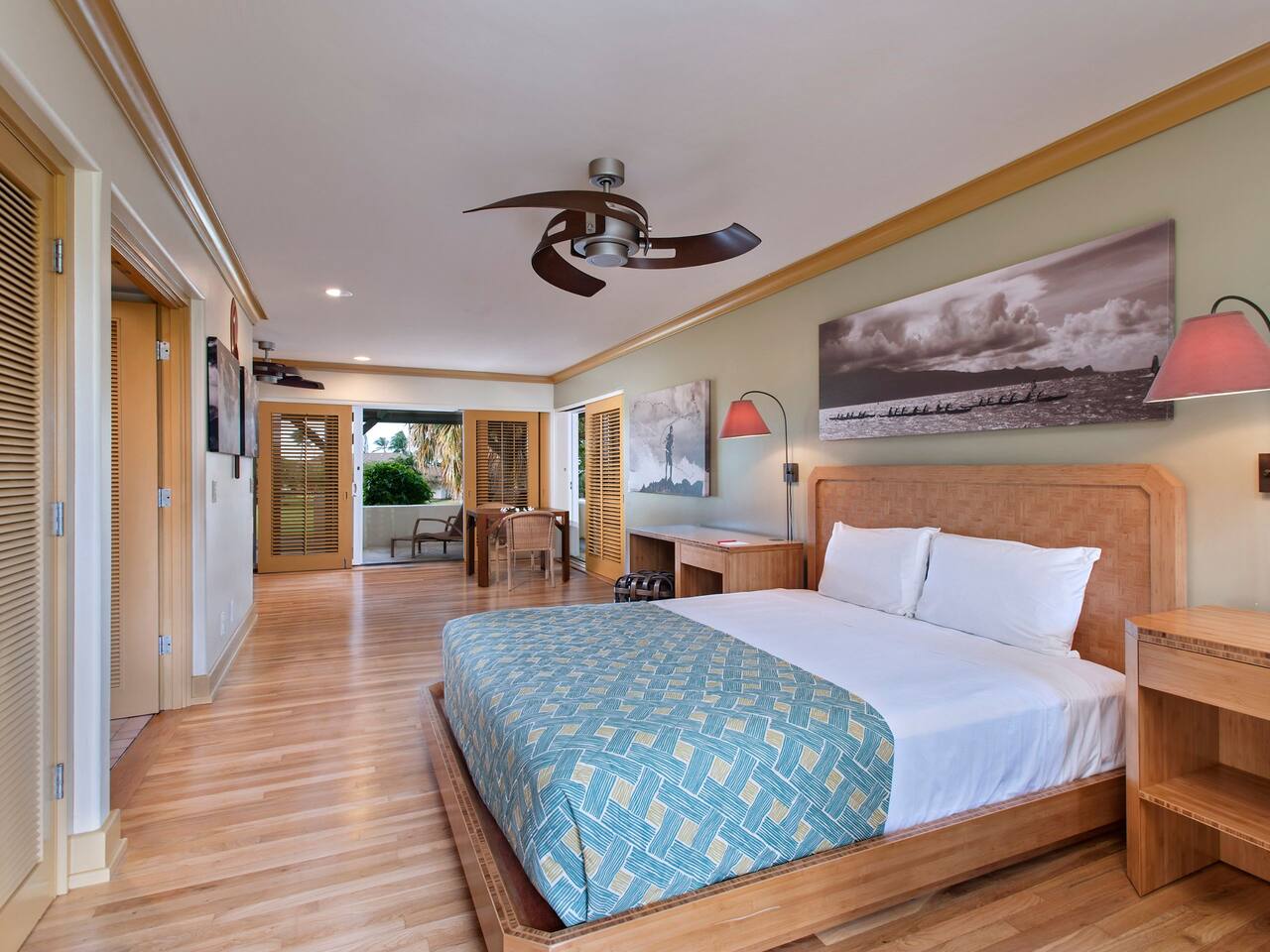 One King Bed Garden View guestroom with lanai and work desk 