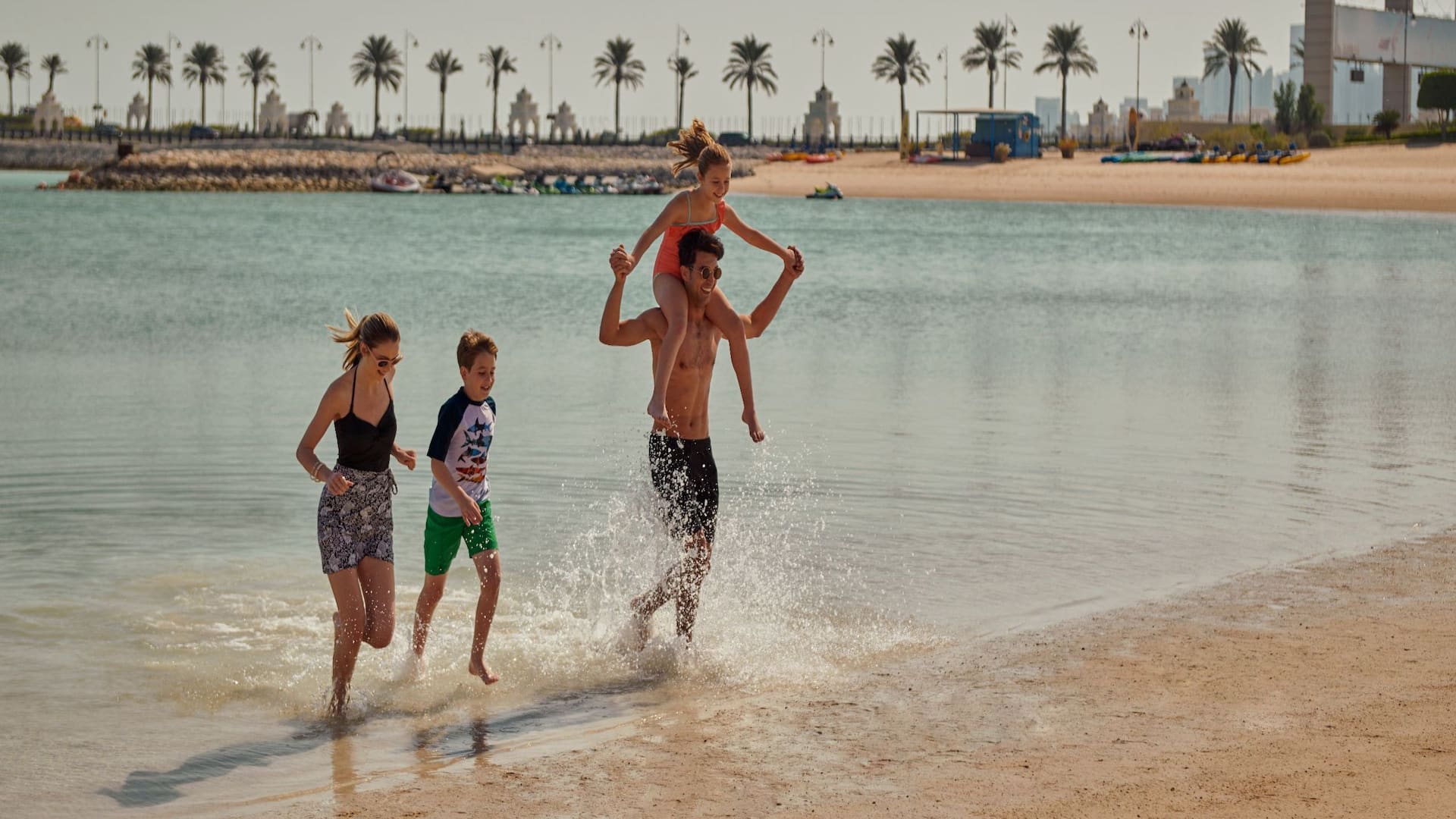 Grand Hyatt Doha Hotel & Villas Family Swimming At Beach