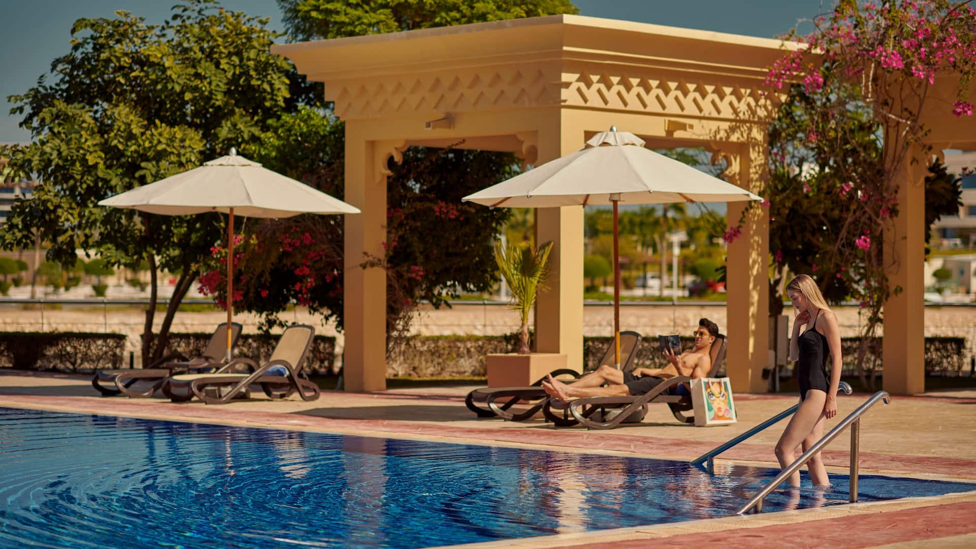 Grand Hyatt Doha Hotel & Villas Couple At Pool
