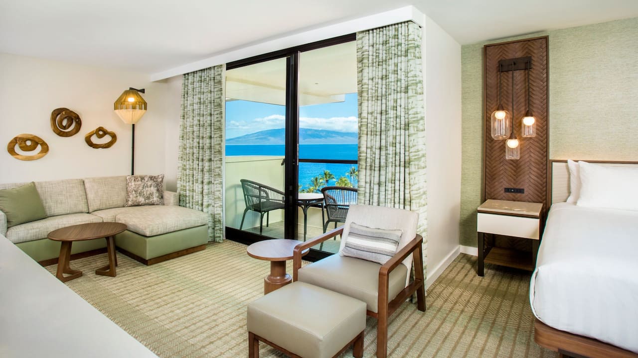 One king bed hotel room with an ocean view