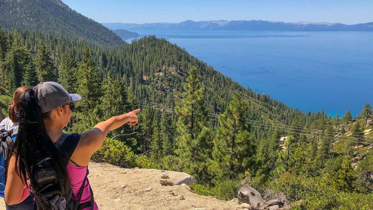 Guests hiking with overlooking and breathtaking scenery of Lake Tahoe at day time