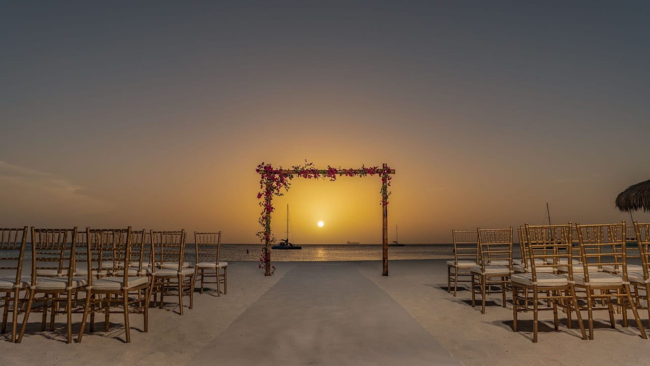 Wedding arch set up for a sunset wedding overlooking the water