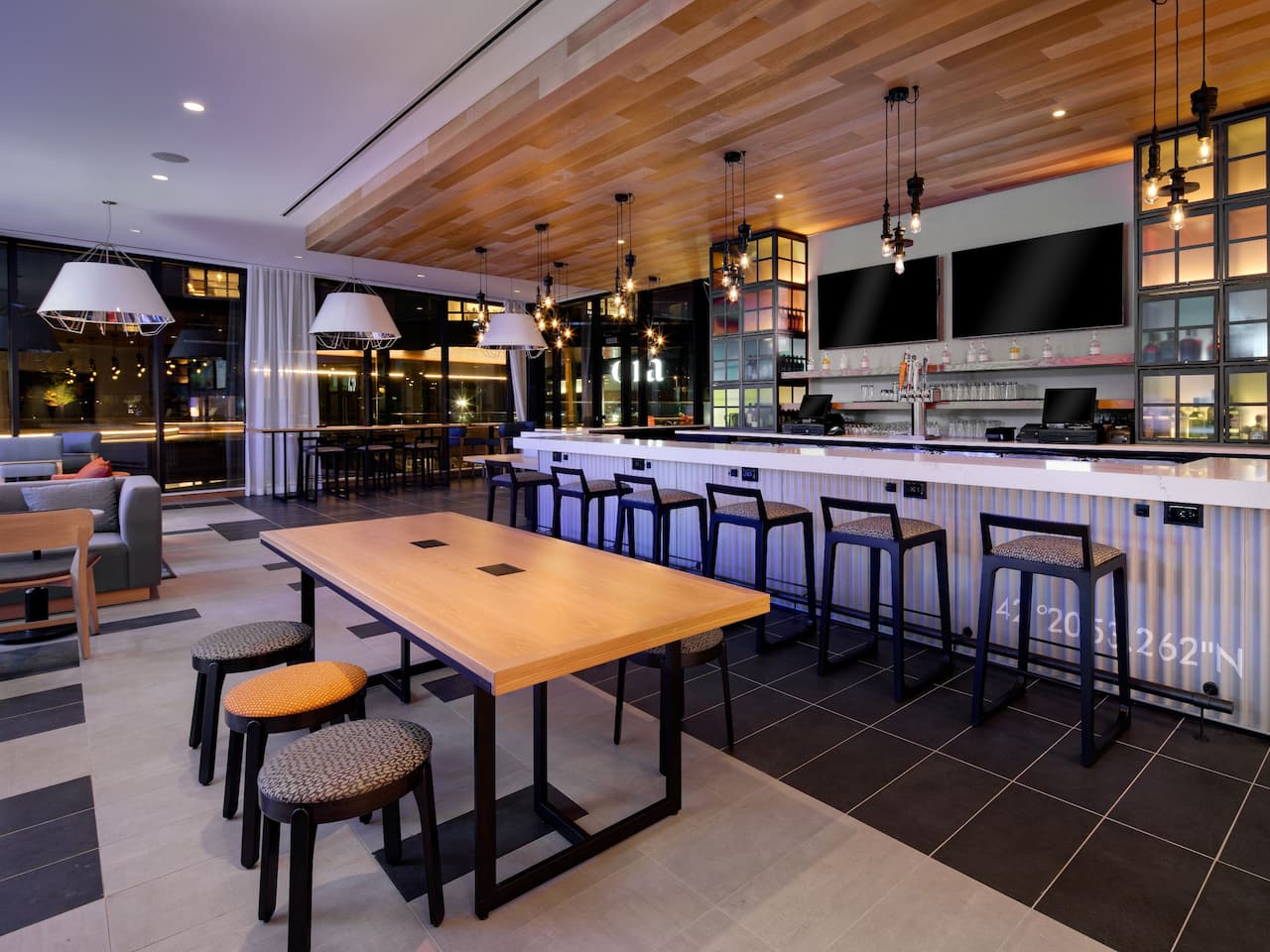 Hyatt Place Boston / Seaport District Modern Bar with a Waterfront View at Seaport District