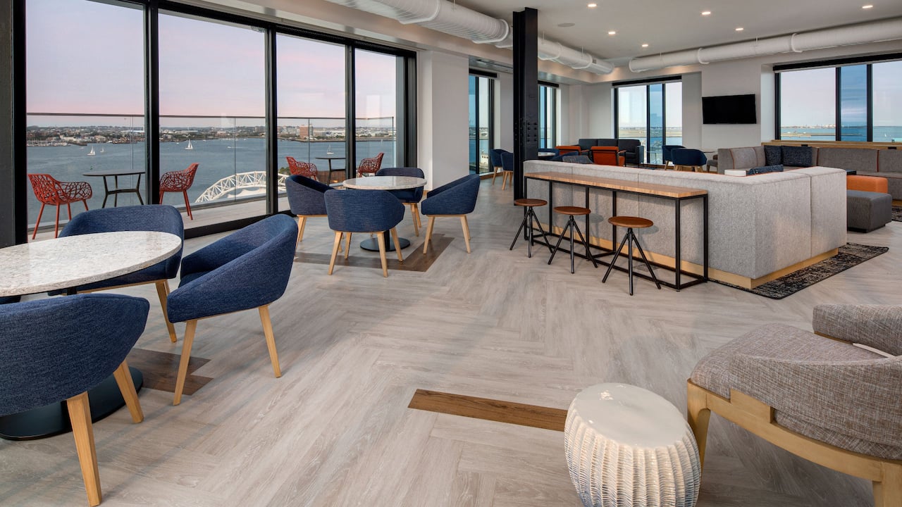 Hyatt Place Boston / Seaport District Upper Lounge Seating with a View of Boston Harbor Waterfront