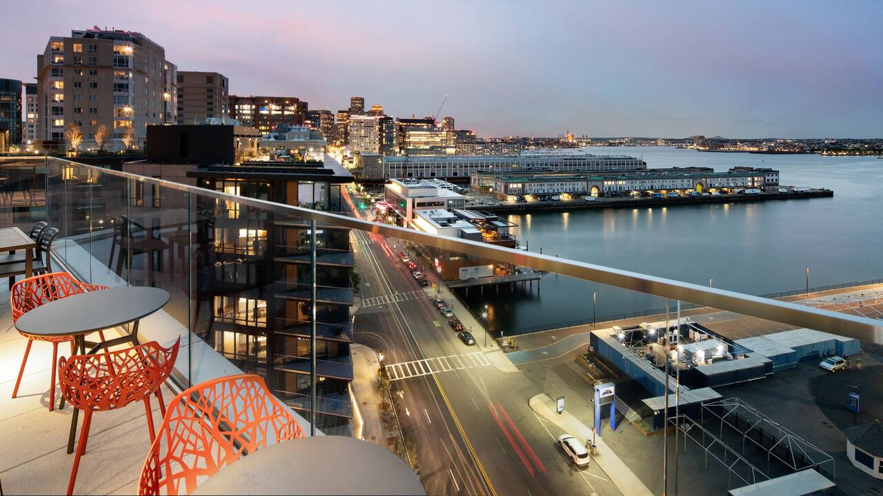 Hyatt Place Boston / Seaport District Upper Roof Deck with View of Boston MA Waterfront