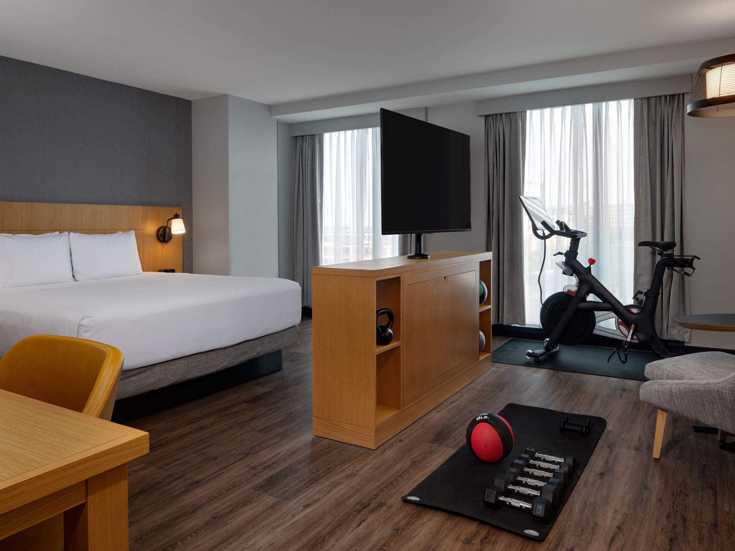 A hotel room featuring a cozy bed and a breathtaking view of
