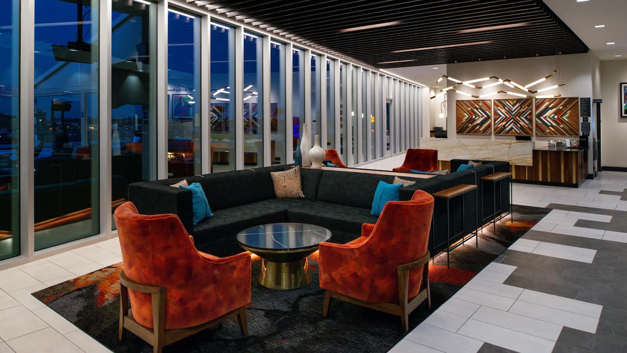 Lobby with seating area and floor-to-ceiling windows