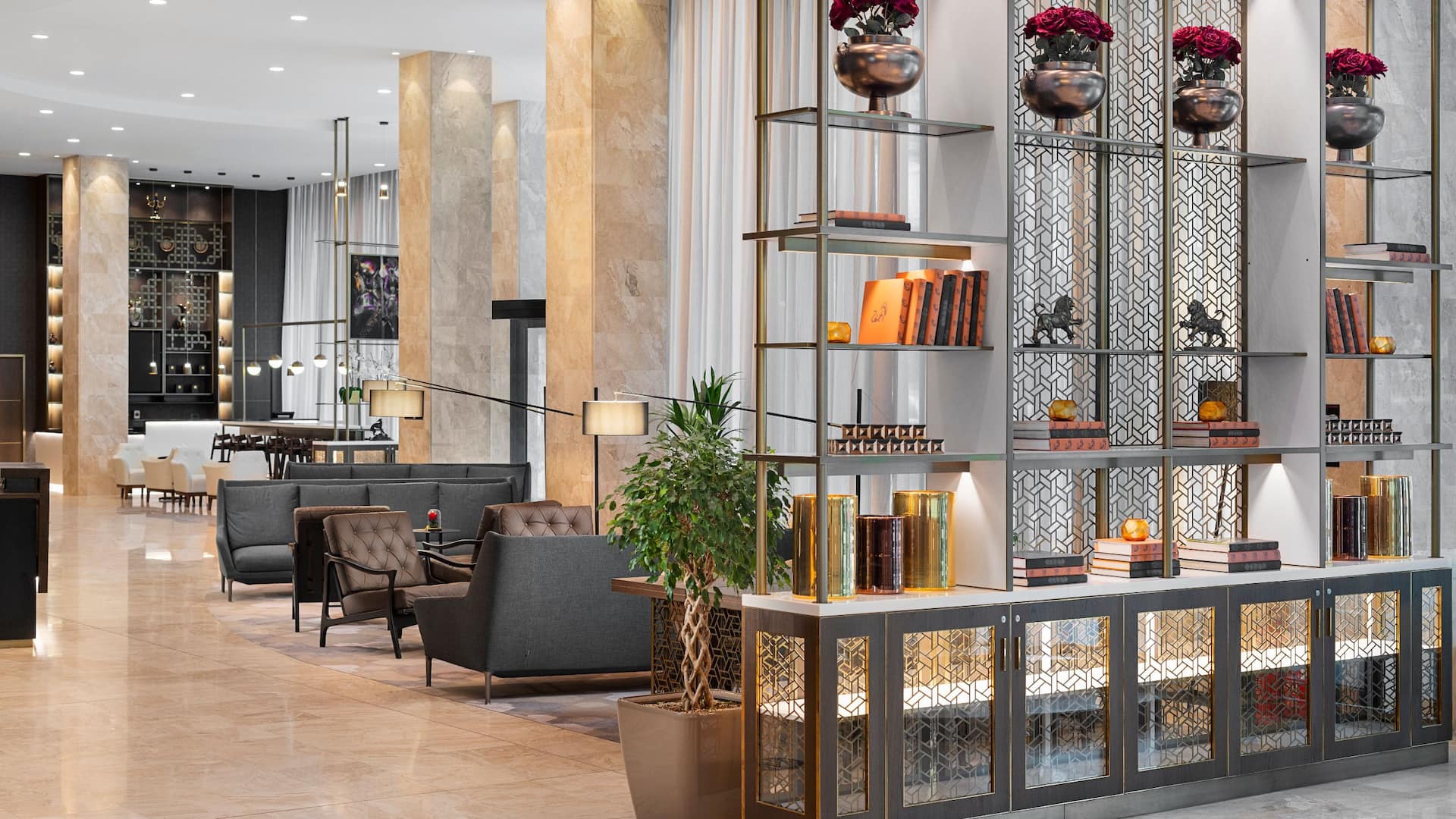Spacious hotel lobby at Hyatt Regency Sofia with contemporary decor, comfortable seating, and a welcoming ambiance.