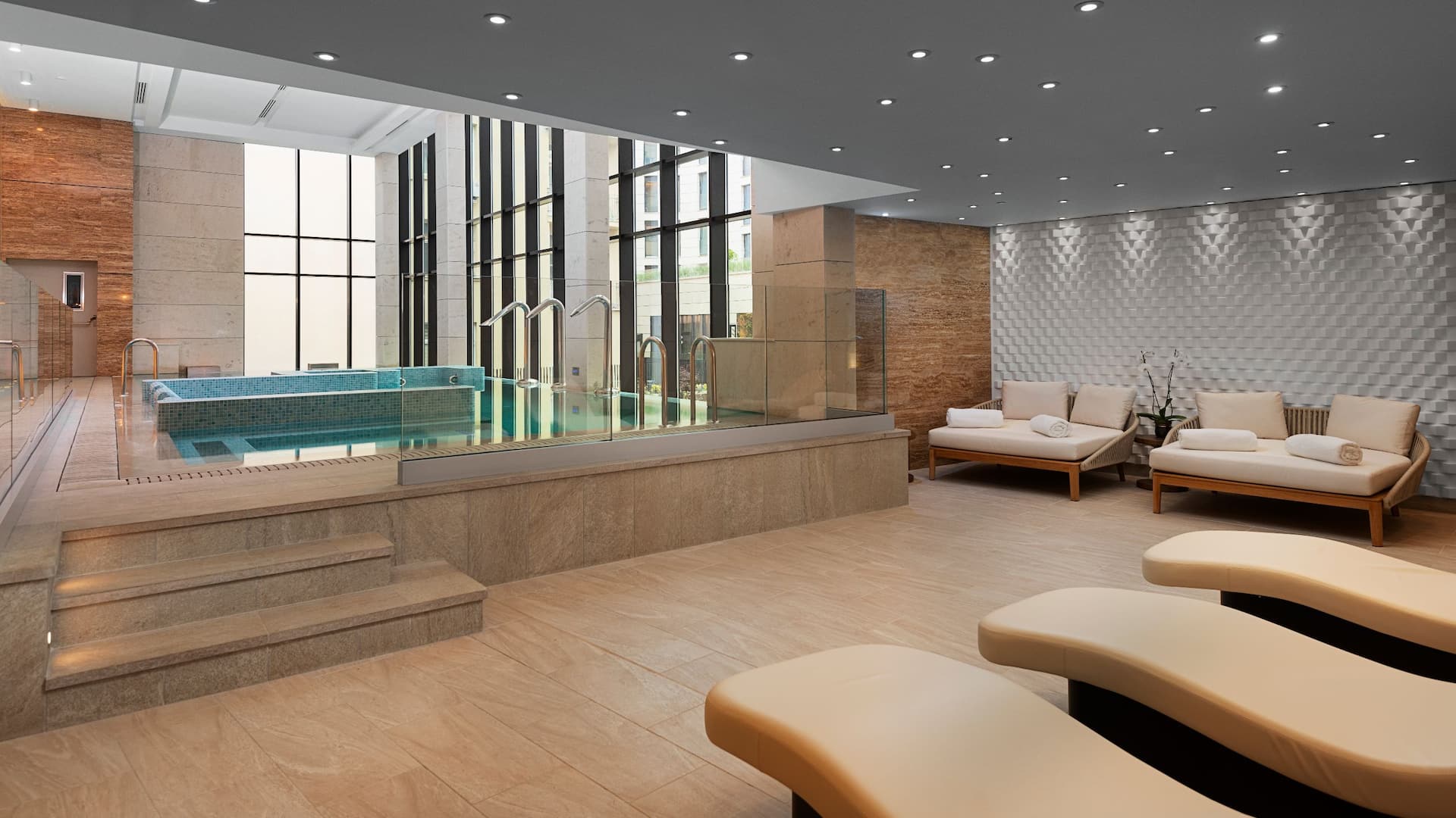 Tranquil Ortus Wellness at Hyatt Regency Sofia, featuring a heated indoor hydrotherapy pool, elegant relaxation lounges, and soothing natural design for the ultimate rejuvenating experience.