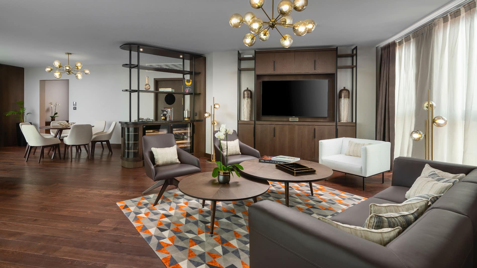 Presidential Suite at Hyatt Regency Sofia featuring a spacious living area with elegant furnishings, a dining space, and contemporary décor, offering a luxurious and comfortable stay