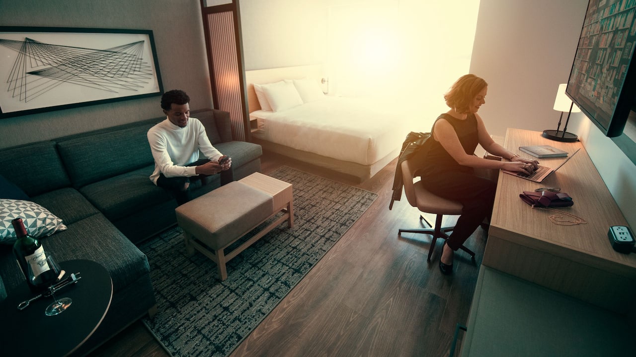 Couple Working in Room