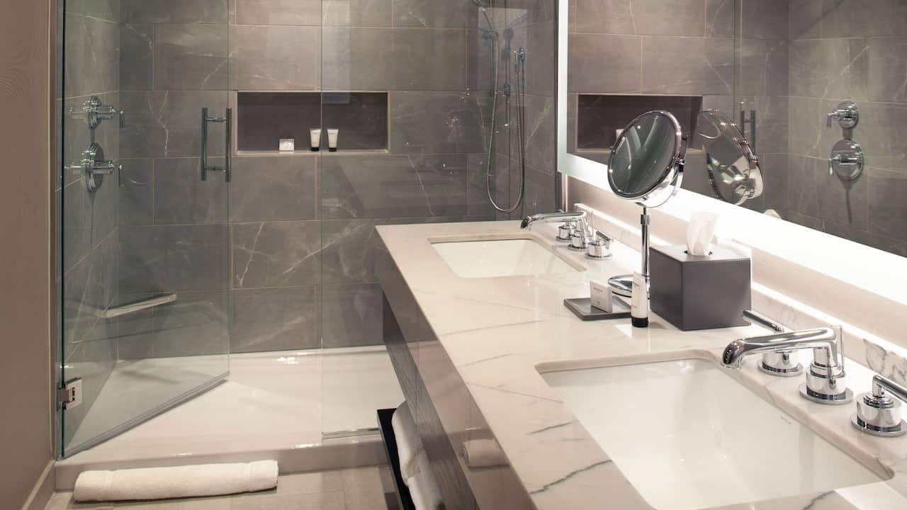 Guest bathroom with double vanity and walk-in shower