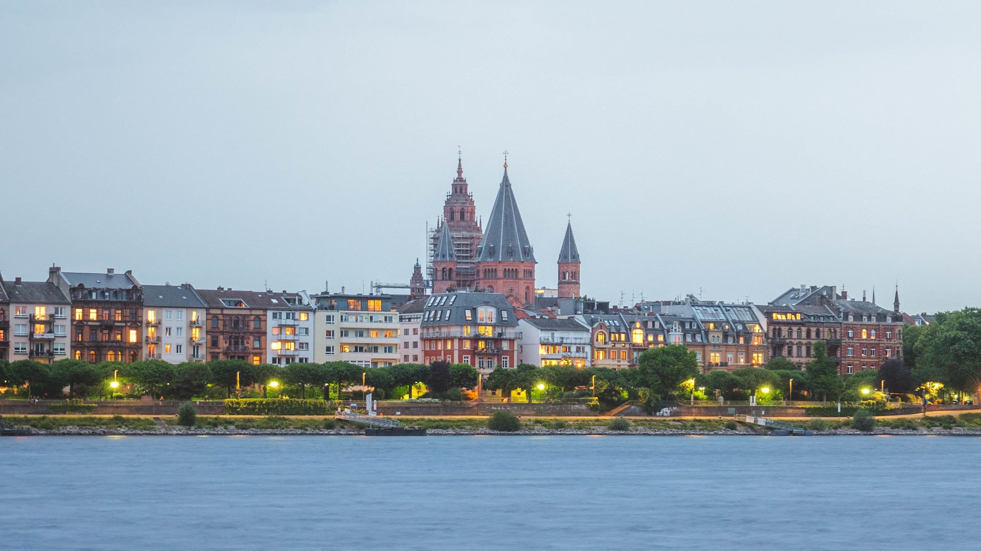 View over the Rhine river near Hyatt Regency Mainz to the banks of the city with the Cathedral in the back during dawn