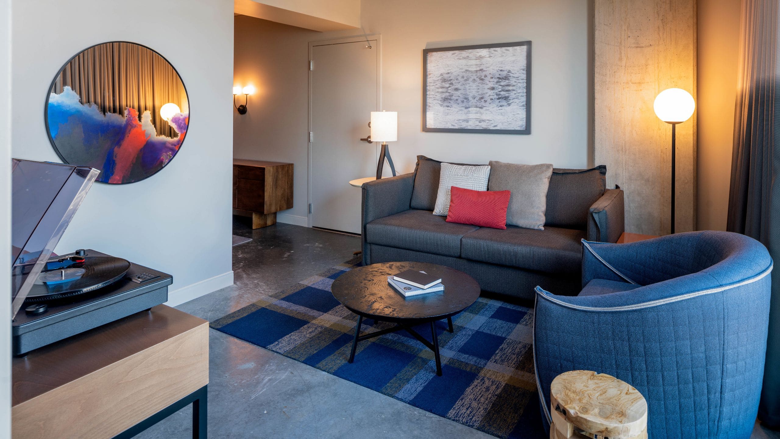 One Bedroom Suite living area with couch, chair, and coffee table