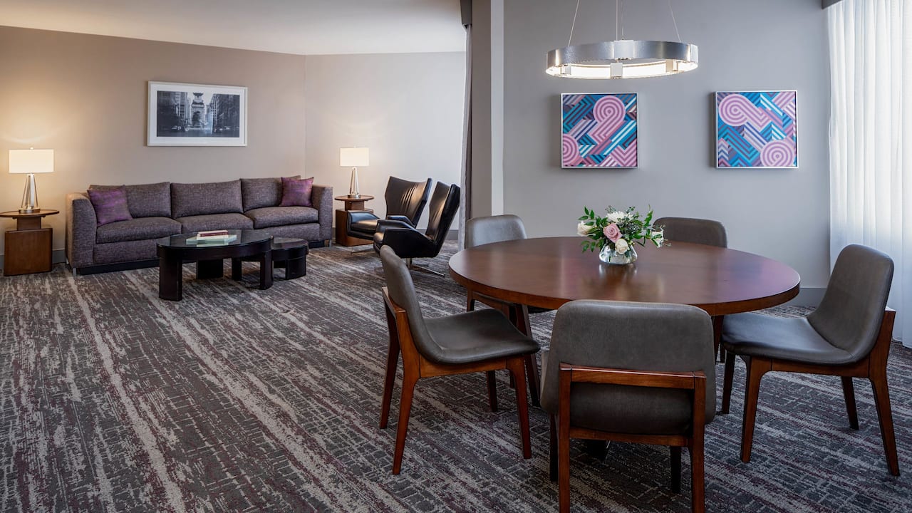 Deluxe Suite with spacious living room and dining table