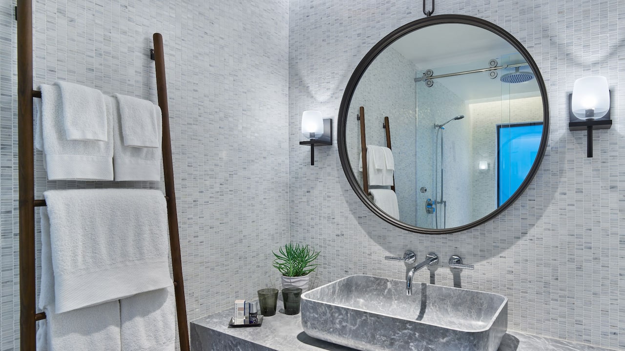 Guestroom bathroom vanity with marble sink