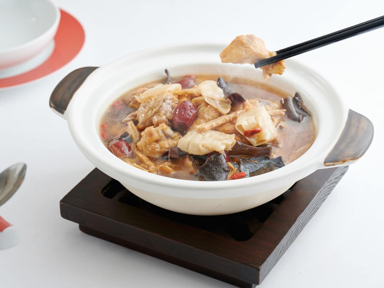 Simmered fish maw and chicken in Chinese yellow wine, ginger, black fungus, red dates, wolfberry 