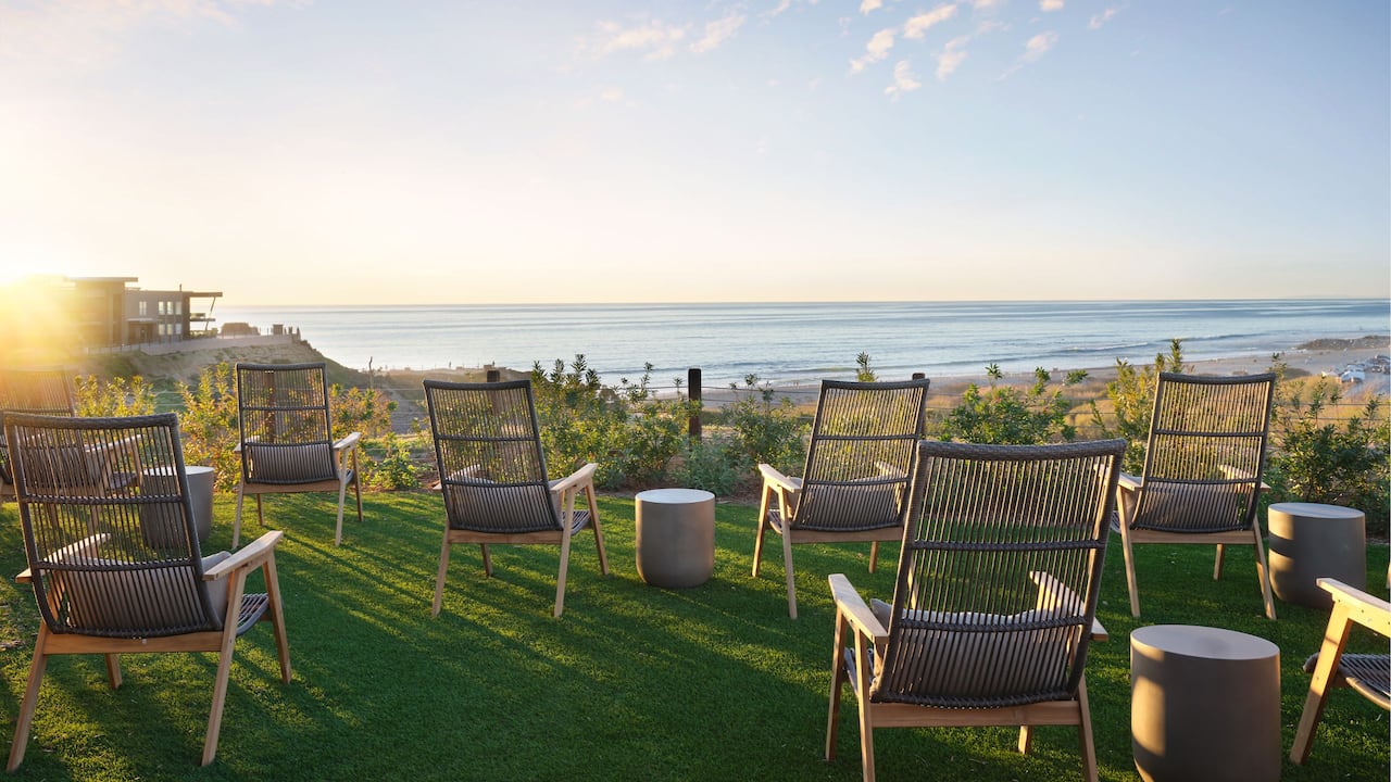 The Perch outdoor lawn with seating area overlooking the ocean
