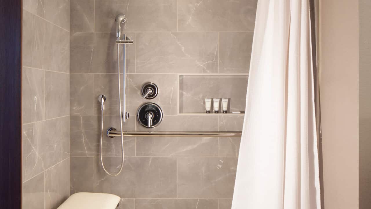 Accessible guest bathroom with roll-in shower