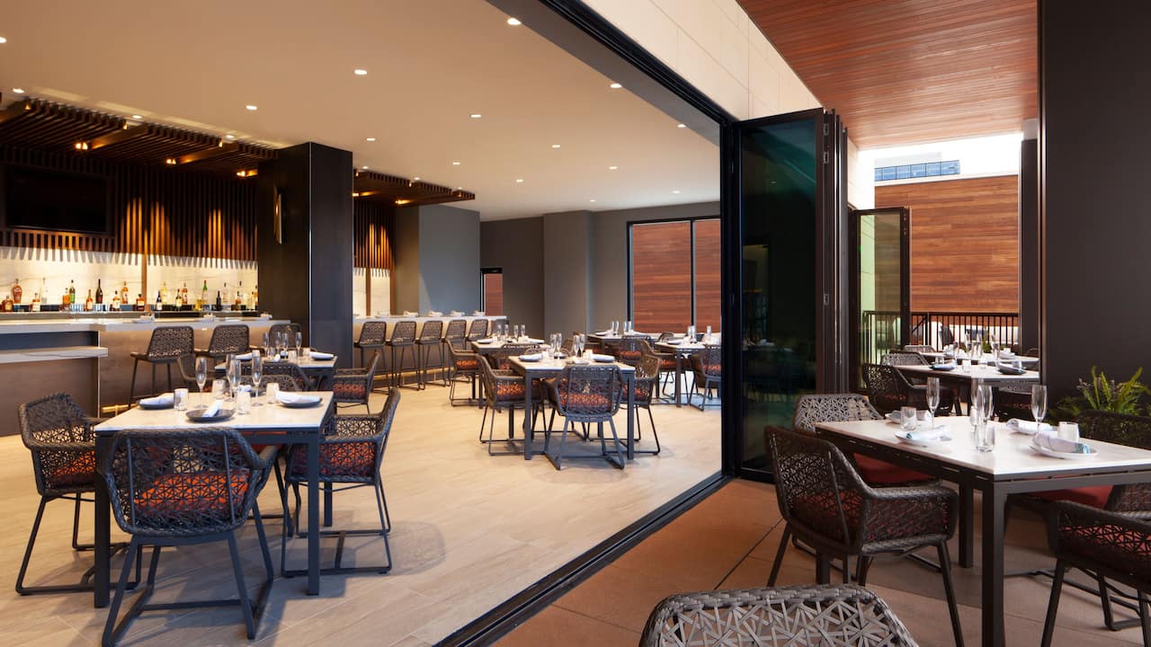 Solstice indoor and outdoor poolside dining area
