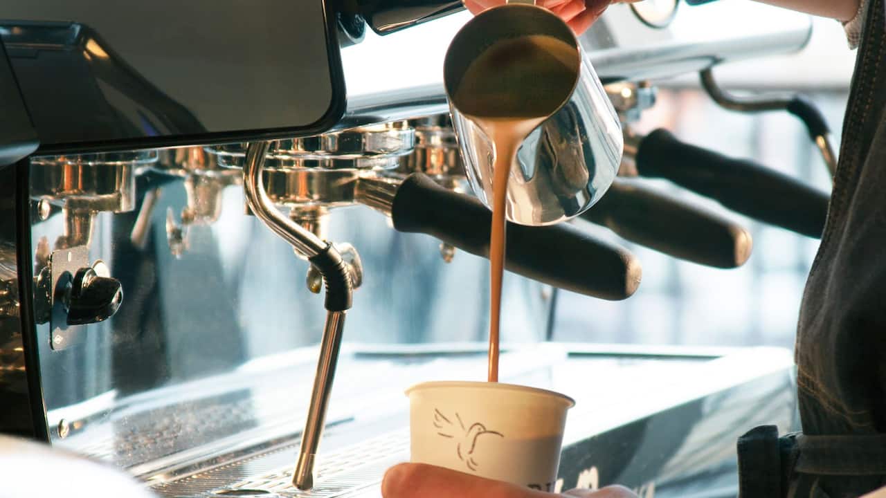 Coffee being poured from an espresso machine