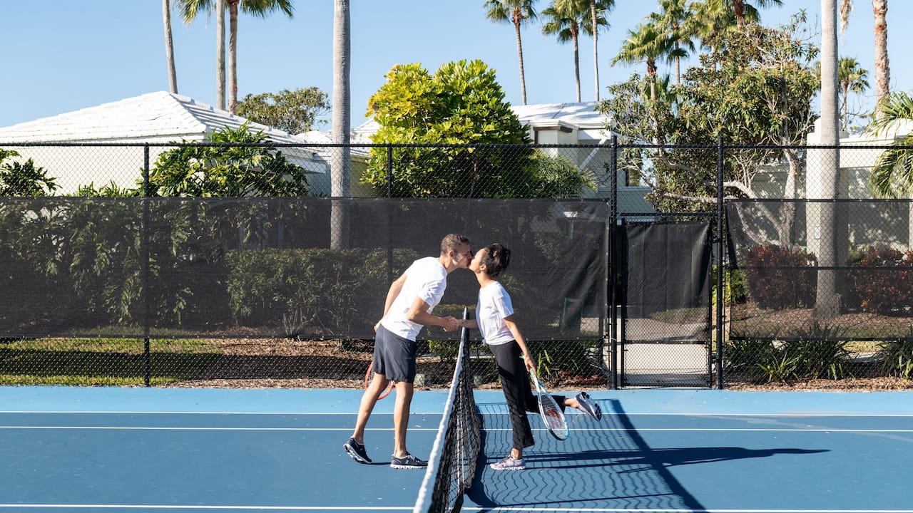 Couple playing tennis 