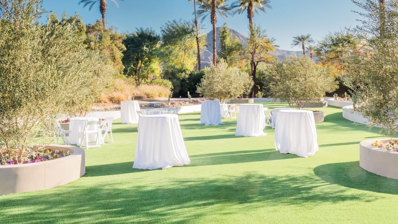 An outdoor wedding ceremony with organized seating in Palm Springs at Hyatt Regency Indian Wells Resort & Spa