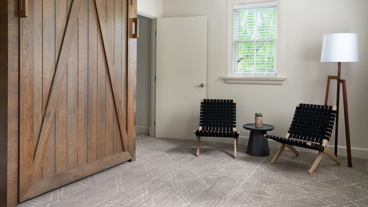 Family Suite Bedroom with murphy bed and chairs