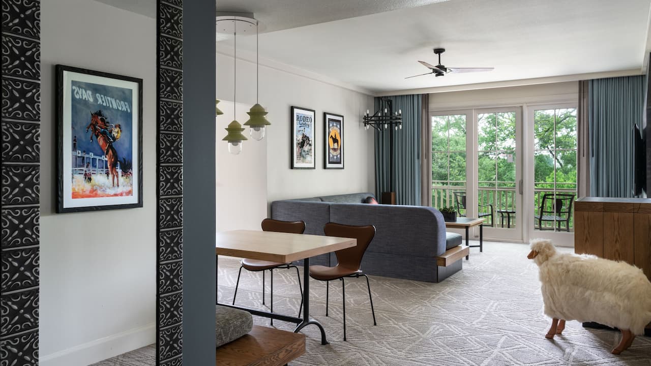 Family Suite living and dining area featuring floor-to-ceiling windows