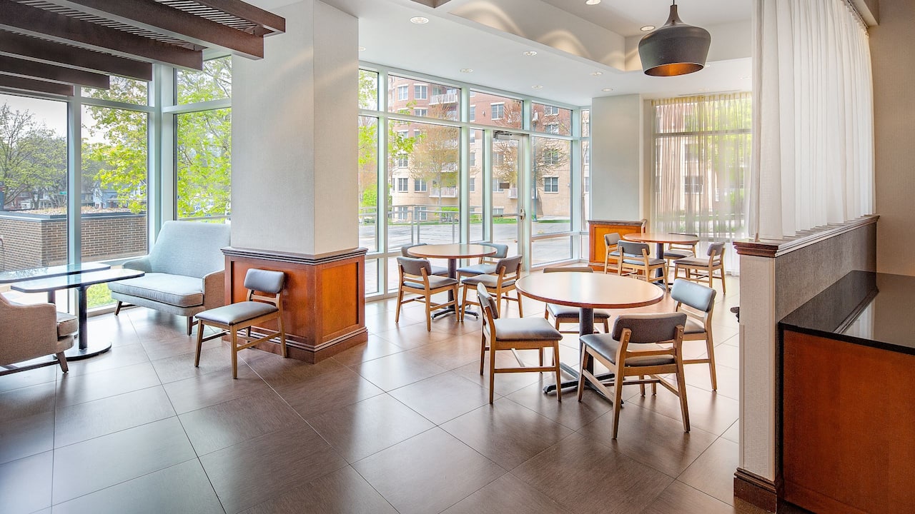 Sunroom dining area with floor-to-ceiling windows