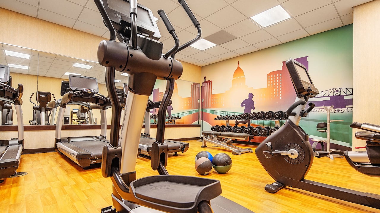 Fitness Center with elliptical machine, treadmills and free weights 