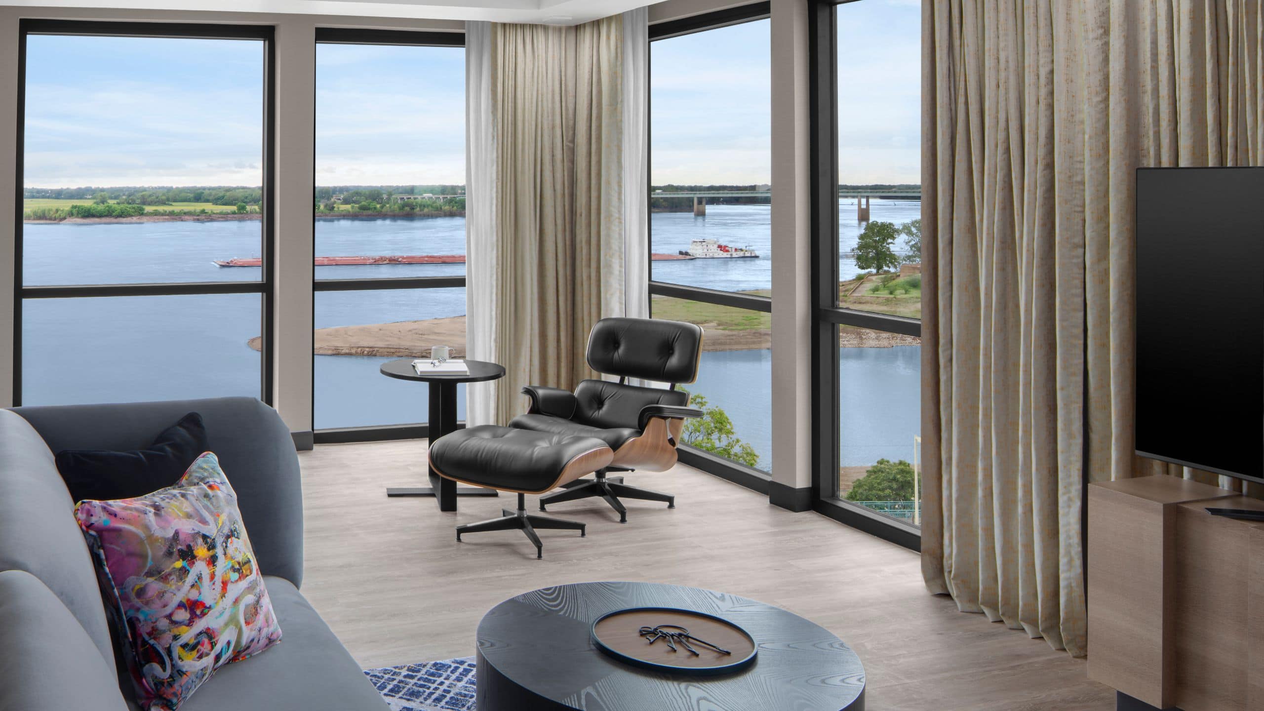 Premier Suite living room area with floor-to-ceiling views of the Mississippi River