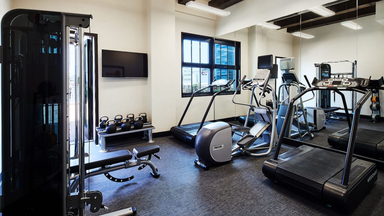 Fitness Center with cardio equipment and kettlebells