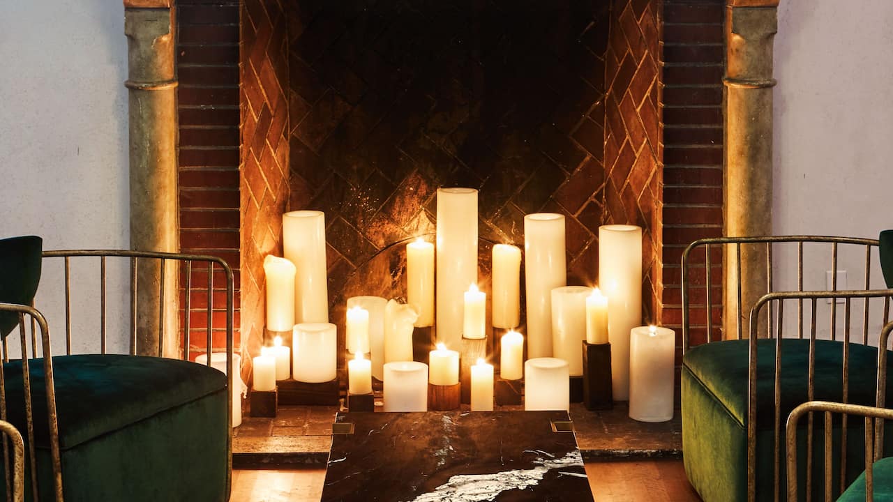 Gran Sala candle-lit fireplace detail