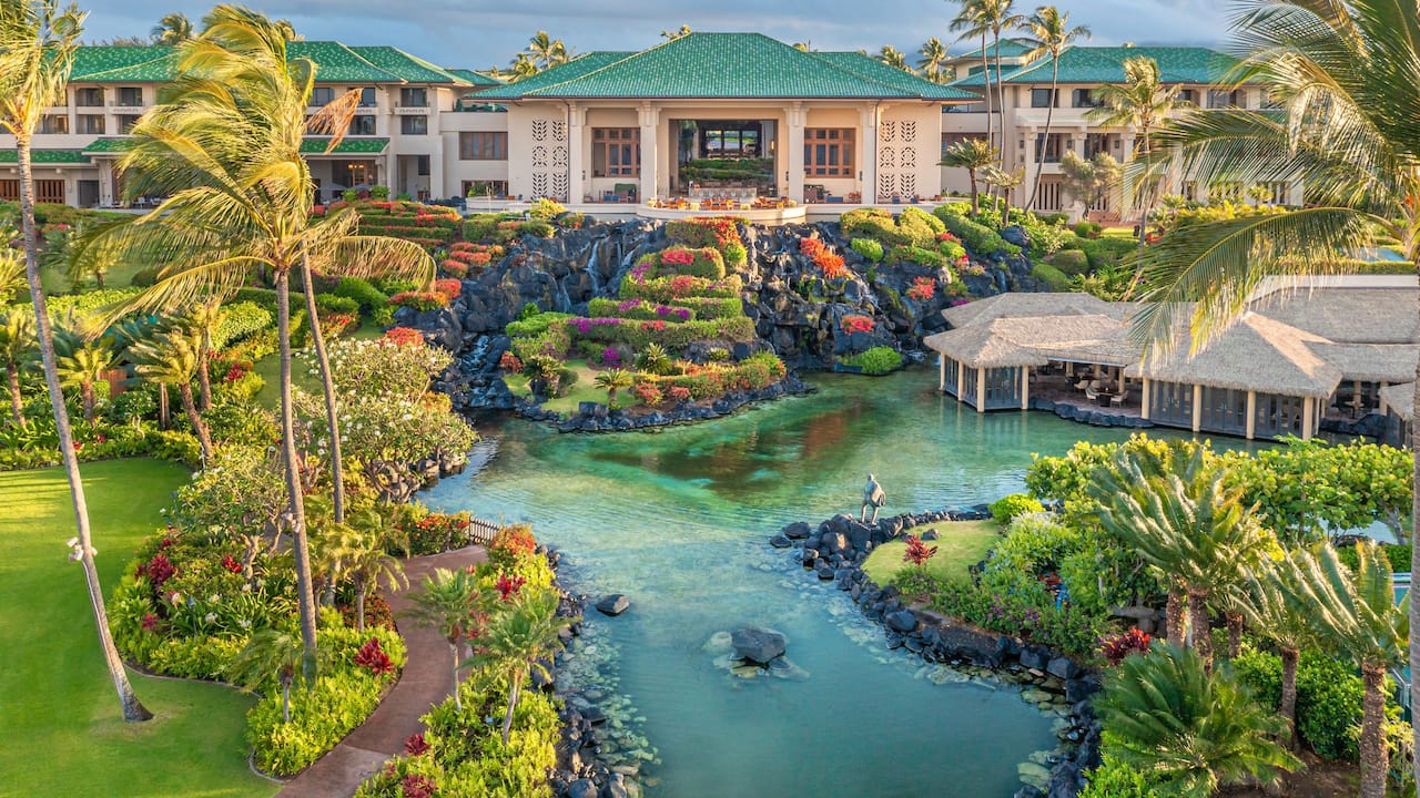 Aerial view from the ocean of Grand Hyatt Kauai Resort and Spa lagoons and waterfall