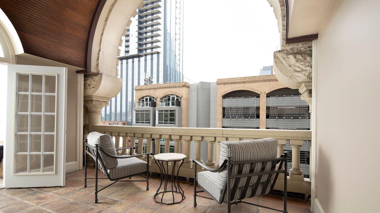 King Suite balcony seating area with city views