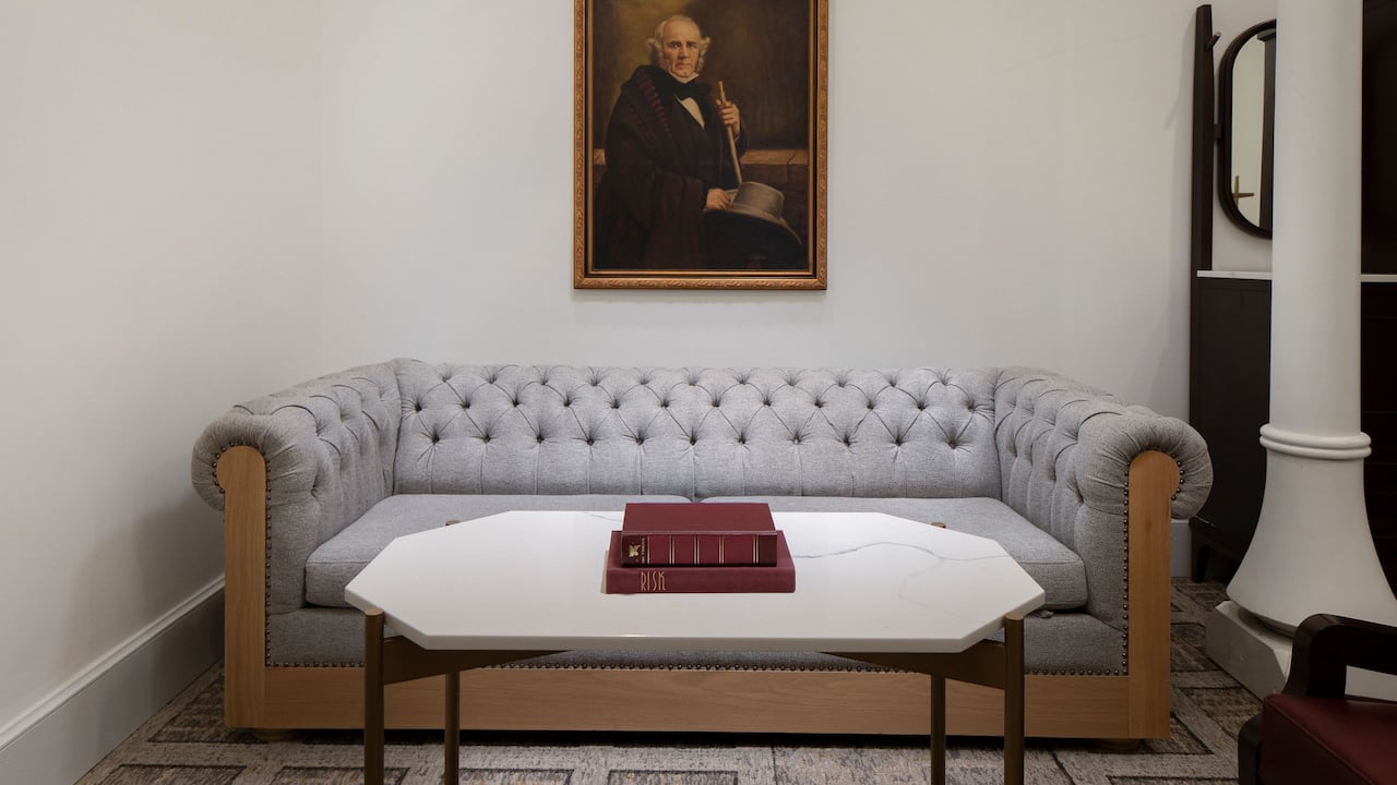 Junior Suite King living area with marble coffee table and elegant couch