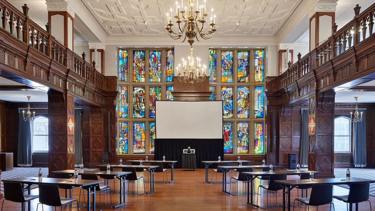 Tudor Ballroom with classroom setup and large screen projector