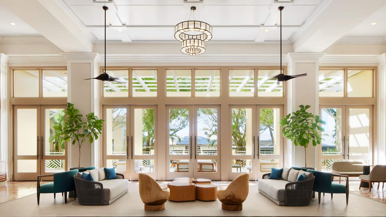 Lobby with seating area and chandelier