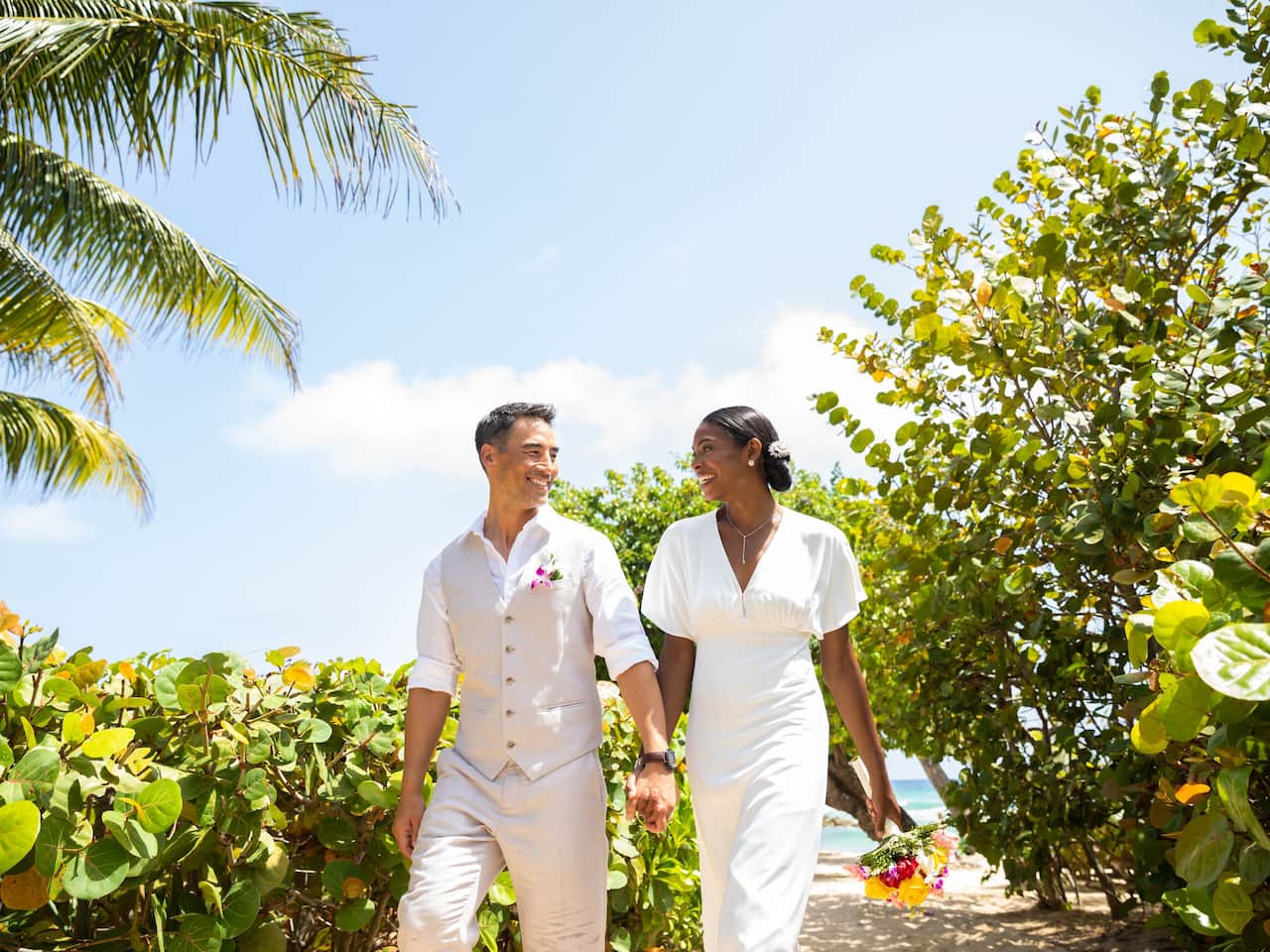 Bride and groom at beach wedding ceremony
