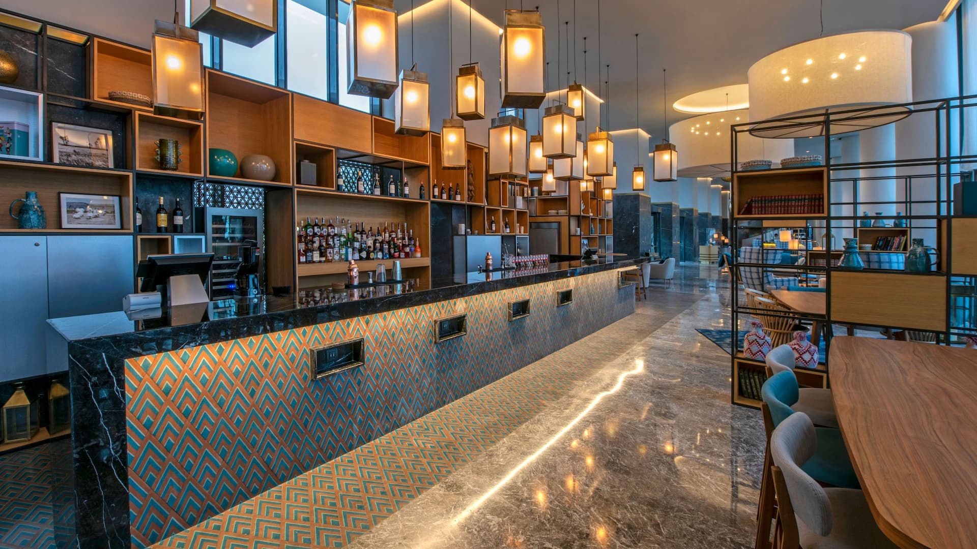 1 of 2 Bar setup in the lobby, elegantly decorated with a refined and welcoming  ambiance